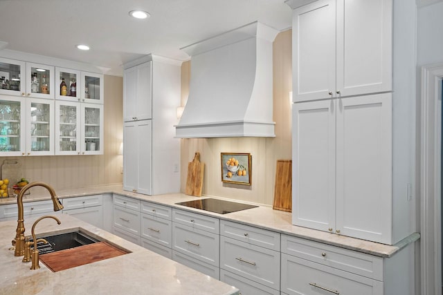 2974 W Mor Dr, Clarksville, TN 37043 - kitchen with custom range hood, black electric cooktop, a sink, white cabinetry, and recessed lighting
