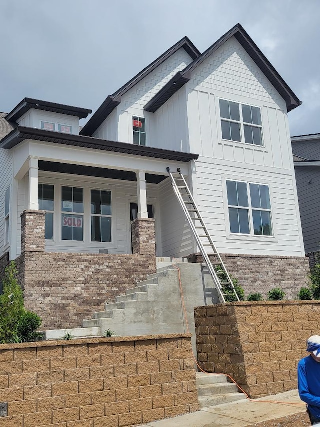 4808 Kintore Dr, Nolensville, TN 37135 - view of front facade with stairway, board and batten siding, and a porch