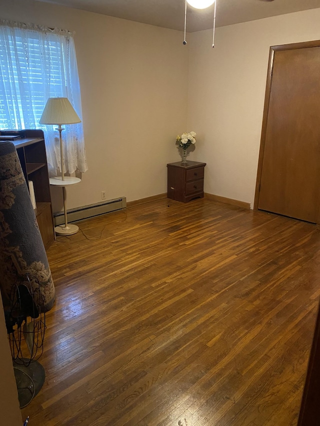 915 Wedgewood Ave, Nashville, TN 37203 - empty room with a baseboard heating unit, wood-type flooring, and ceiling fan