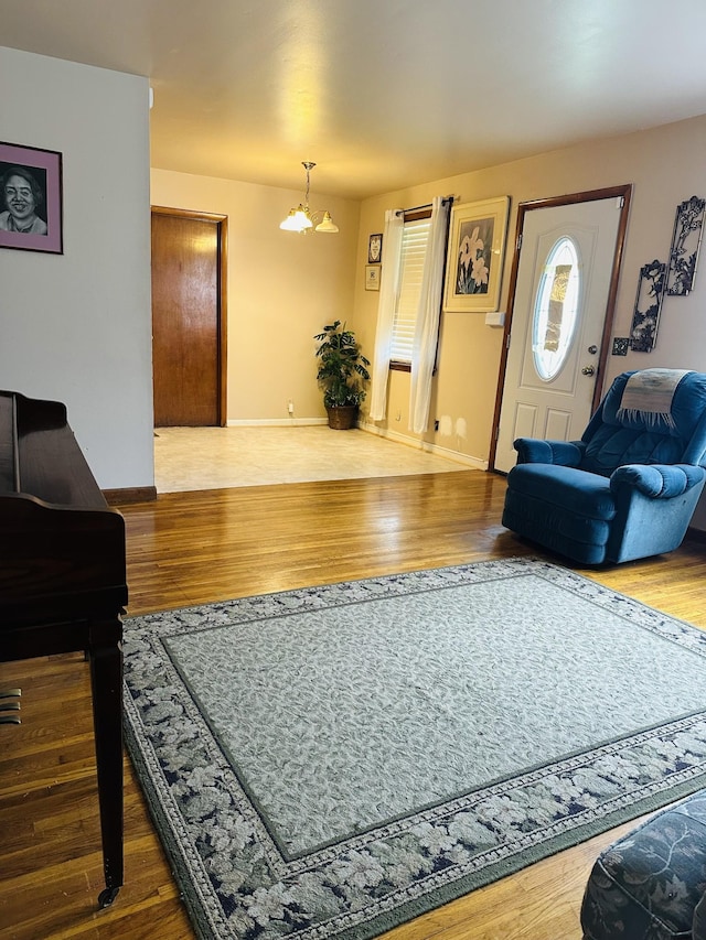 915 Wedgewood Ave, Nashville, TN 37203 - living room with wood finished floors, baseboards, and a chandelier