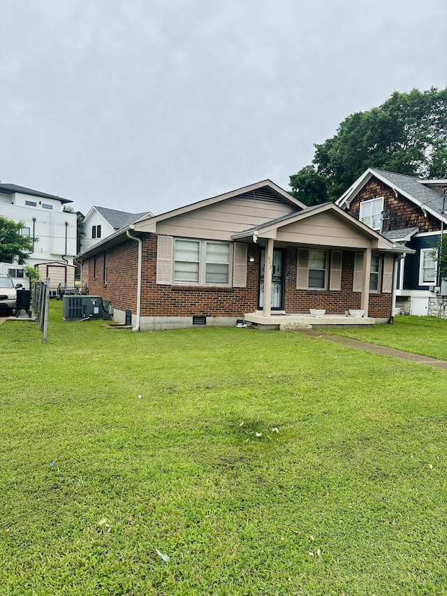 915 Wedgewood Ave, Nashville, TN 37203 - view of front facade featuring a porch, brick siding, and a front yard