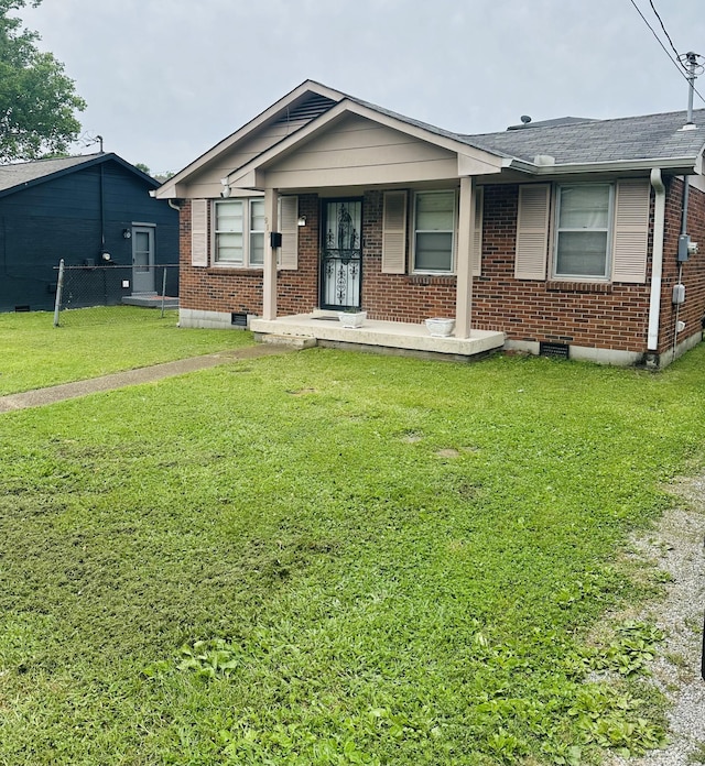 915 Wedgewood Ave, Nashville, TN 37203 - view of front of house with brick siding, covered porch, and a shingled roof