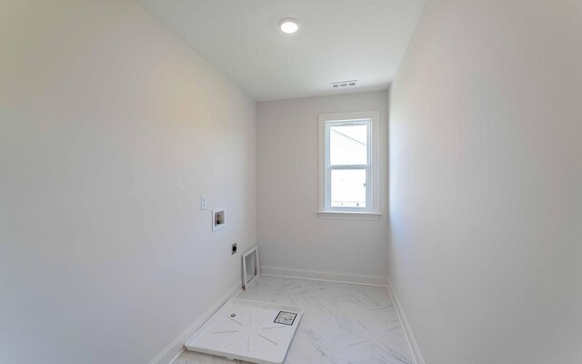 198 John T Alexander Blvd, Hendersonville, TN 37075 - laundry room with hookup for an electric dryer, hookup for a washing machine, light marble finish flooring, and baseboards