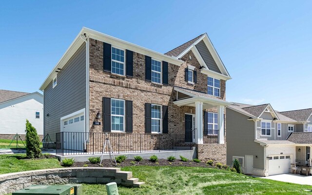 198 John T Alexander Blvd, Hendersonville, TN 37075 - craftsman house featuring a garage, brick siding, and concrete driveway