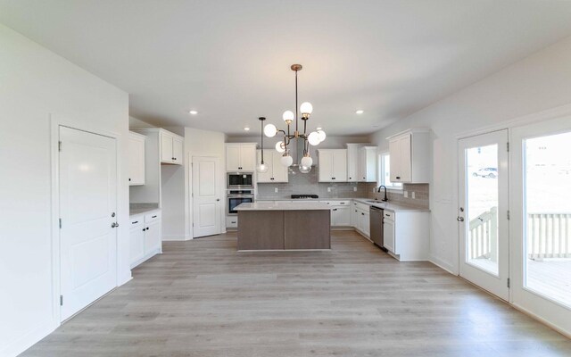 198 John T Alexander Blvd, Hendersonville, TN 37075 - kitchen with appliances with stainless steel finishes, a sink, a chandelier, tasteful backsplash, and a kitchen island