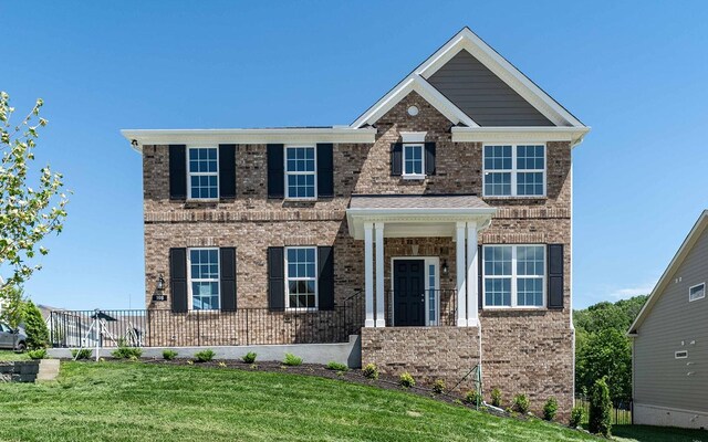 198 John T Alexander Blvd, Hendersonville, TN 37075 - view of front facade featuring a front lawn and brick siding