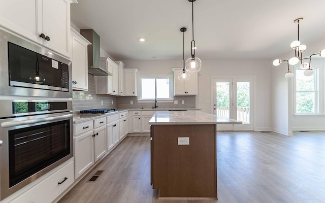 198 John T Alexander Blvd, Hendersonville, TN 37075 - kitchen with stainless steel appliances, plenty of natural light, backsplash, and recessed lighting