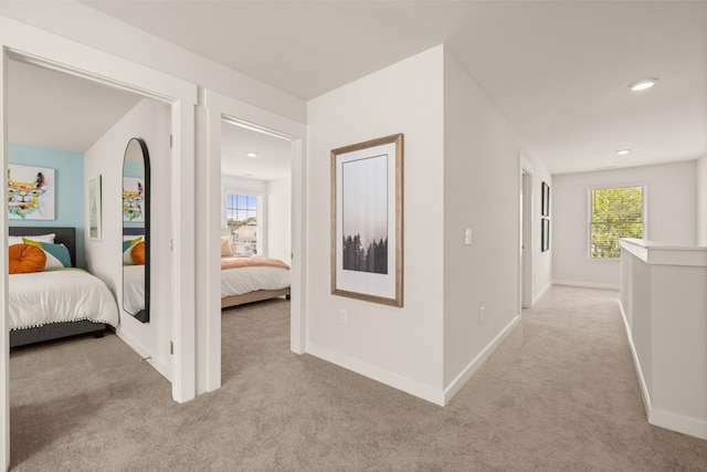 7212 Hanworth St, Fairview, TN 37062 - hallway with light carpet, plenty of natural light, baseboards, and recessed lighting