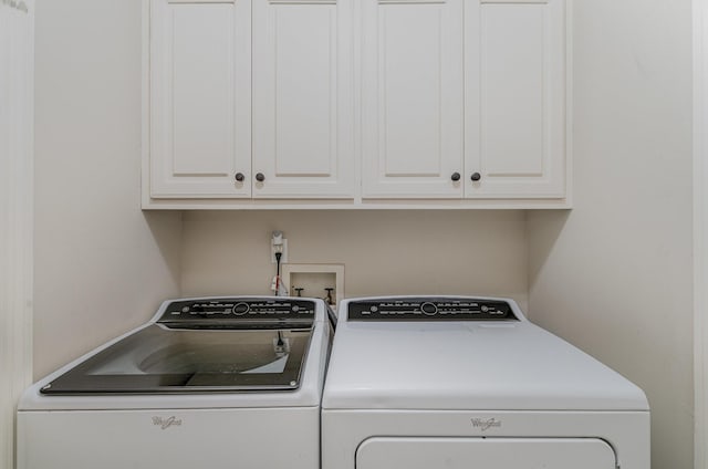 256 Scenic Dr, Dickson, TN 37055 - laundry area featuring washing machine and clothes dryer and cabinet space