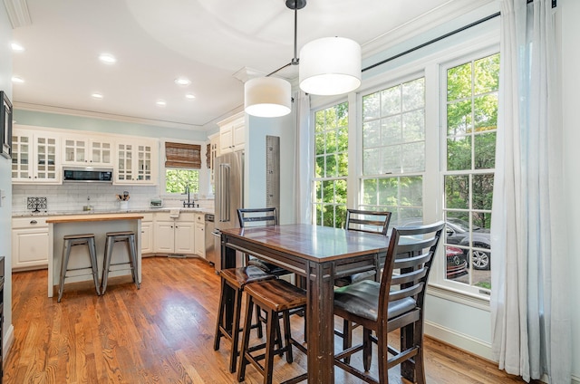 256 Scenic Dr, Dickson, TN 37055 - dining area featuring ornamental molding, light wood finished floors, recessed lighting, and baseboards