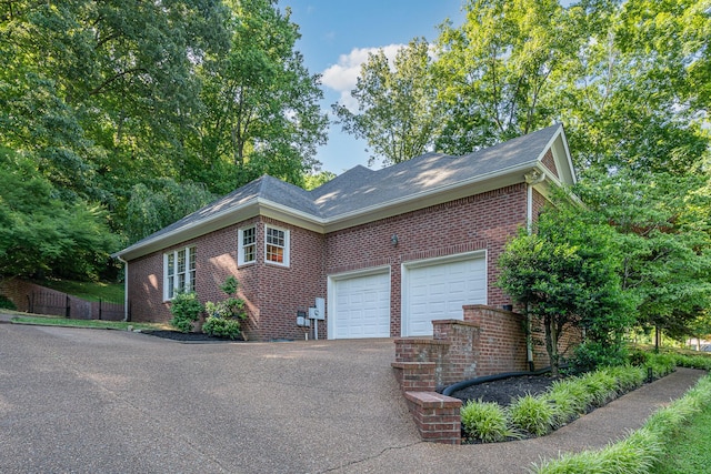 256 Scenic Dr, Dickson, TN 37055 - view of front of house with brick siding, driveway, and a garage