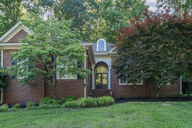 256 Scenic Dr, Dickson, TN 37055 - view of property hidden behind natural elements featuring a front lawn and brick siding