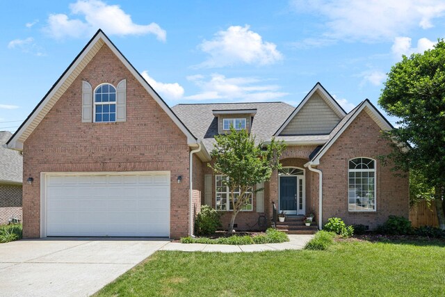 416 Bethany Cir, Murfreesboro, TN 37128 - view of front facade with brick siding, driveway, a front lawn, and roof with shingles
