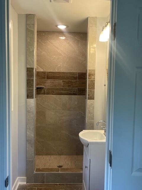 4805 Buena Vista Pike, Nashville, TN 37218 - full bath with vanity and a tile shower