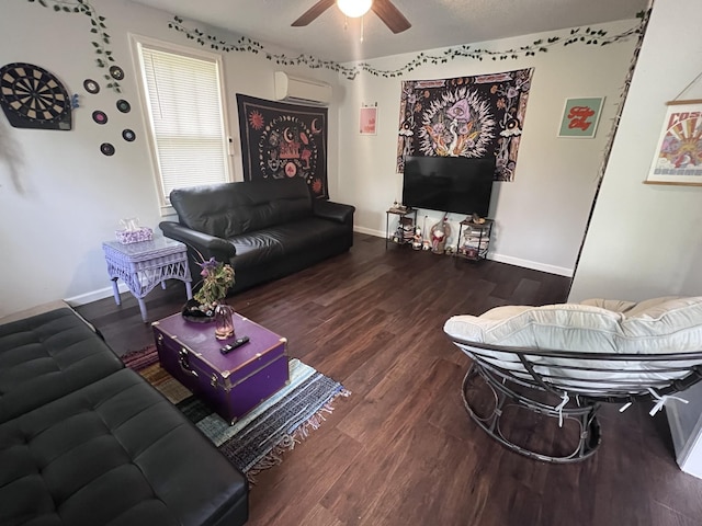 962 3rd St, Tracy City, TN 37387 - living room featuring a wall unit AC, wood finished floors, a ceiling fan, and baseboards
