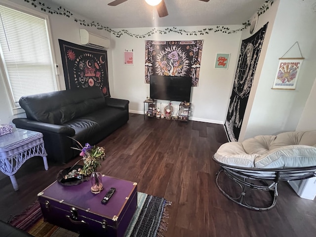 962 3rd St, Tracy City, TN 37387 - living room with a wall unit AC, a ceiling fan, wood finished floors, and baseboards