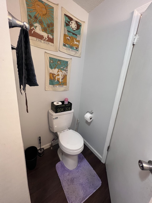 962 3rd St, Tracy City, TN 37387 - bathroom with toilet, wood finished floors, and baseboards