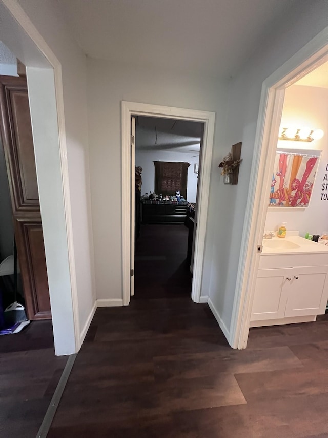 962 3rd St, Tracy City, TN 37387 - hall featuring baseboards, dark wood finished floors, and a sink