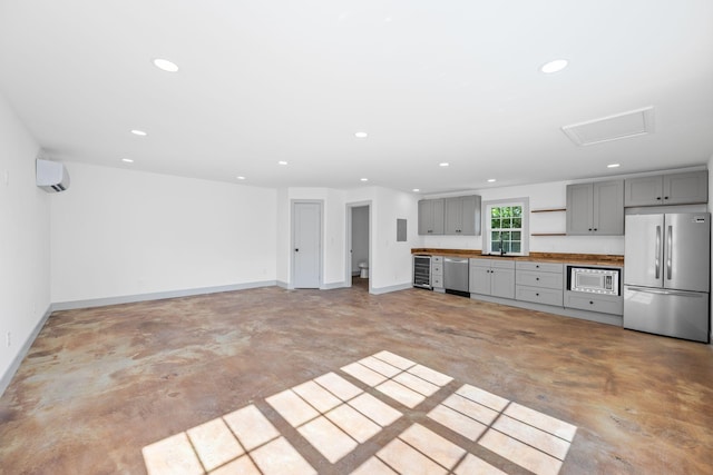 1607 Riverside Dr, Nashville, TN 37216 - kitchen with appliances with stainless steel finishes, gray cabinets, recessed lighting, concrete floors, and baseboards
