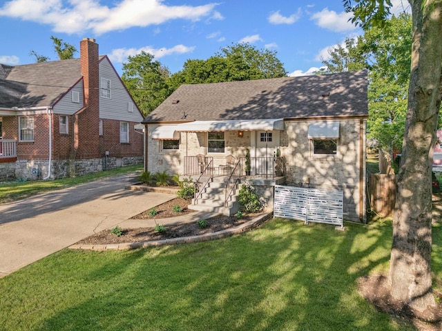 1607 Riverside Dr, Nashville, TN 37216 - view of front of house featuring brick siding and a front lawn