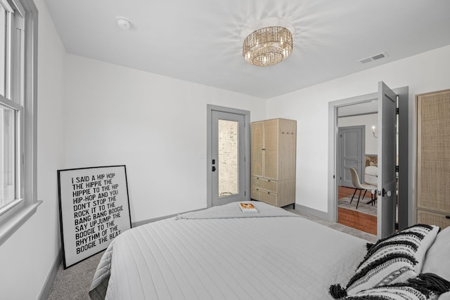 1607 Riverside Dr, Nashville, TN 37216 - bedroom featuring baseboards, carpet, and a chandelier
