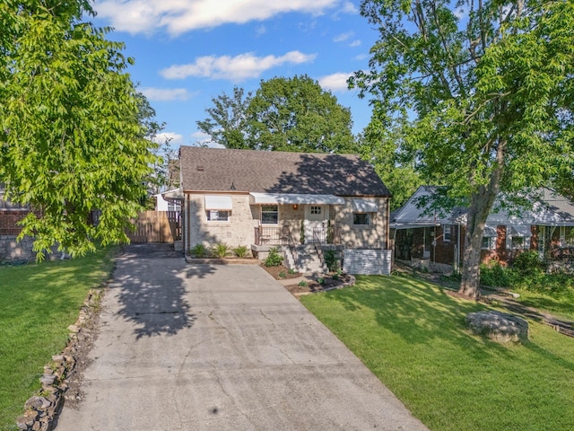 1607 Riverside Dr, Nashville, TN 37216 - bungalow-style home featuring concrete driveway, brick siding, and roof with shingles