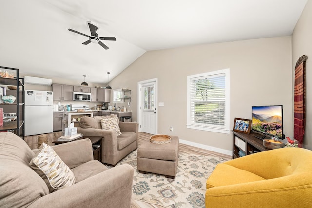 3269 Moodyville Rd, Byrdstown, TN 38549 - living area featuring ceiling fan, vaulted ceiling, light wood-type flooring, and baseboards
