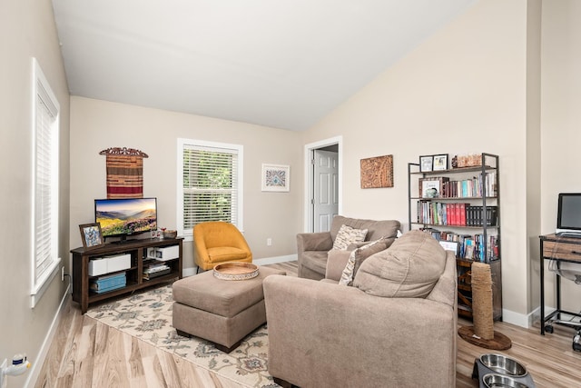 3269 Moodyville Rd, Byrdstown, TN 38549 - living room with baseboards, light wood finished floors, and lofted ceiling