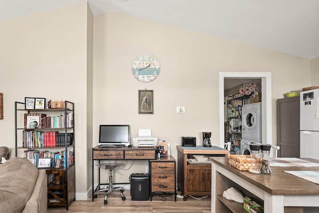 3269 Moodyville Rd, Byrdstown, TN 38549 - office with stacked washer / drying machine, vaulted ceiling, and wood finished floors