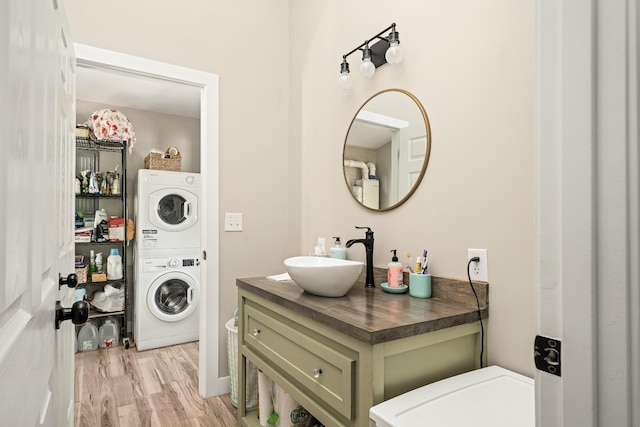 3269 Moodyville Rd, Byrdstown, TN 38549 - bathroom with estacked washer and dryer, wood finished floors, and vanity
