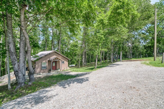 3269 Moodyville Rd, Byrdstown, TN 38549 - view of front of property with driveway and metal roof