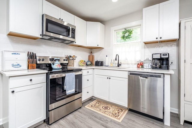 107 Beech St, Columbia, TN 38401 - kitchen with appliances with stainless steel finishes, a sink, and light countertops