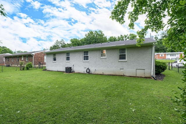 107 Beech St, Columbia, TN 38401 - rear view of house with crawl space, brick siding, and central air condition unit