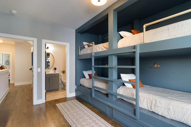 2910 Felicia St Unit 19, Nashville, TN 37209 - bedroom with wood finished floors, baseboards, and ensuite bathroom