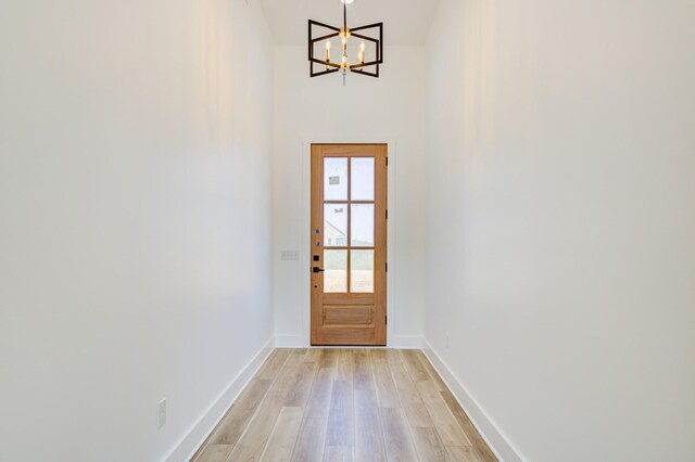 296 Lookout Dr, Winchester, TN 37398 - doorway to outside featuring a chandelier, light wood-style flooring, and baseboards