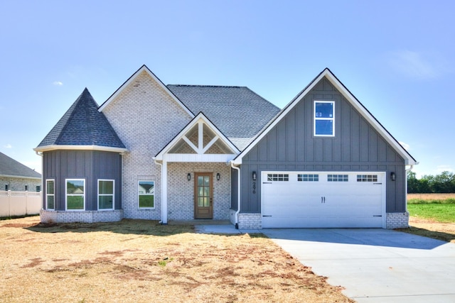 296 Lookout Dr, Winchester, TN 37398 - view of front facade featuring board and batten siding, driveway, and brick siding