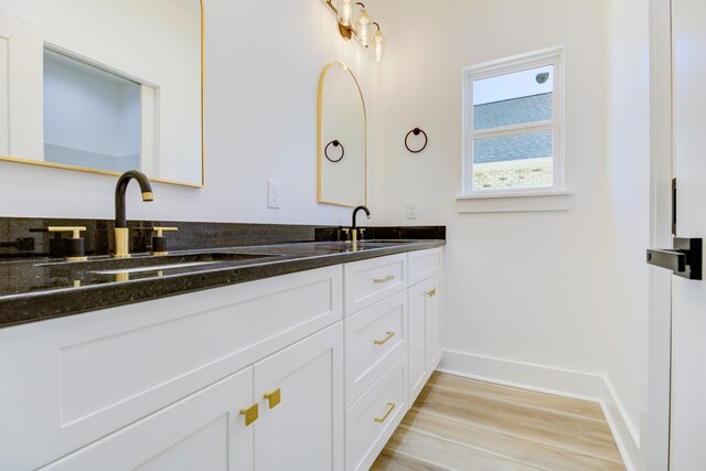 296 Lookout Dr, Winchester, TN 37398 - full bathroom with double vanity, wood finished floors, and baseboards