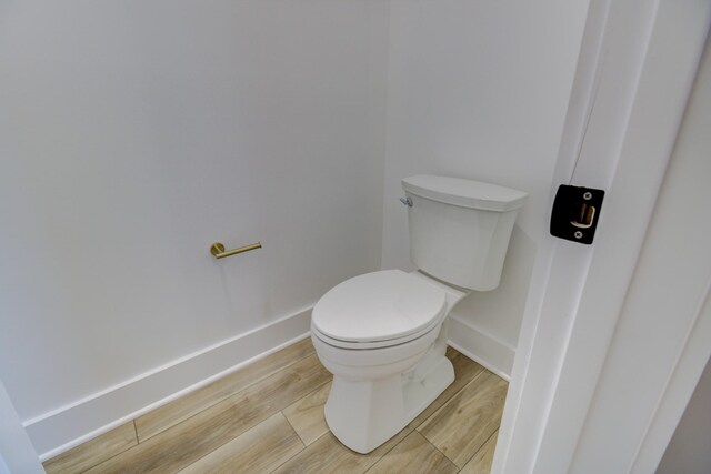 296 Lookout Dr, Winchester, TN 37398 - bathroom with baseboards, toilet, and wood finished floors
