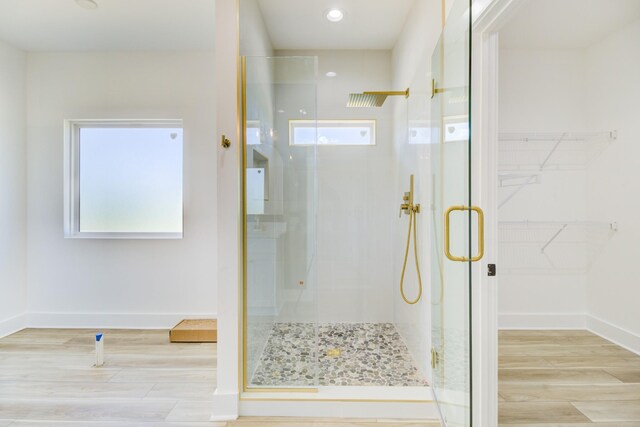 296 Lookout Dr, Winchester, TN 37398 - bathroom with a stall shower, healthy amount of natural light, baseboards, and wood finished floors
