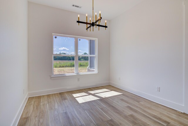 296 Lookout Dr, Winchester, TN 37398 - unfurnished room with a chandelier, light wood-style flooring, and baseboards