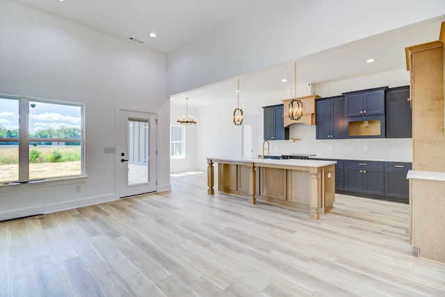 296 Lookout Dr, Winchester, TN 37398 - kitchen with light countertops, healthy amount of natural light, light wood-type flooring, recessed lighting, and a towering ceiling