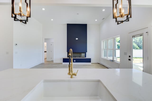 296 Lookout Dr, Winchester, TN 37398 - kitchen featuring a chandelier, a high ceiling, recessed lighting, open floor plan, and light wood finished floors