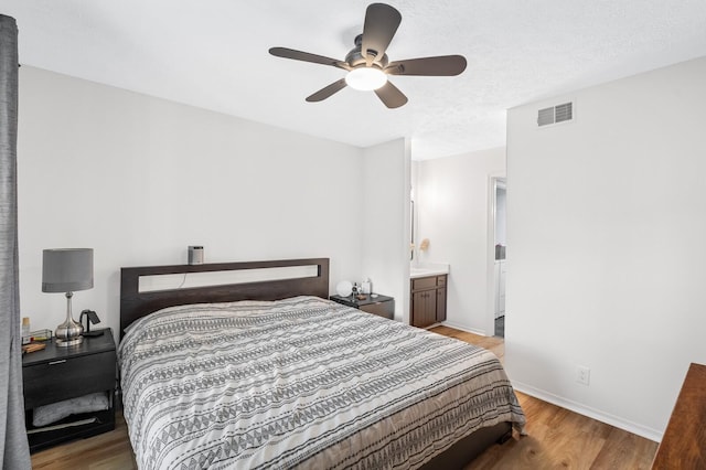 919 Rachels Pl, Hermitage, TN 37076 - bedroom featuring wood finished floors, baseboards, ceiling fan, and connected bathroom
