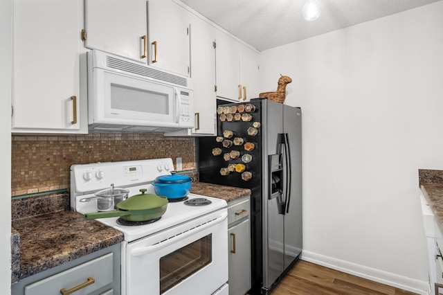 919 Rachels Pl, Hermitage, TN 37076 - kitchen with white appliances, wood finished floors, backsplash, and baseboards