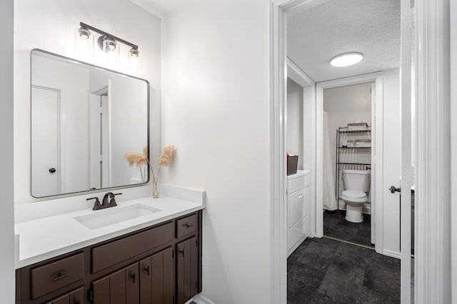 919 Rachels Pl, Hermitage, TN 37076 - bathroom featuring vanity, toilet, and a textured ceiling