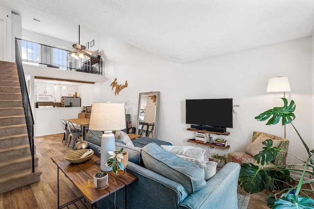 919 Rachels Pl, Hermitage, TN 37076 - living area with wood finished floors, stairway, a ceiling fan, and a textured ceiling
