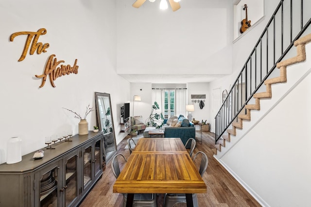 919 Rachels Pl, Hermitage, TN 37076 - dining space featuring wood finished floors, stairway, a high ceiling, a ceiling fan, and baseboards
