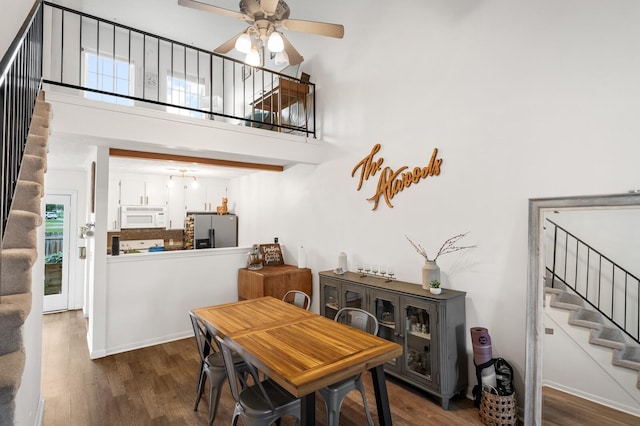 919 Rachels Pl, Hermitage, TN 37076 - dining area with stairway, wood finished floors, a ceiling fan, and a towering ceiling