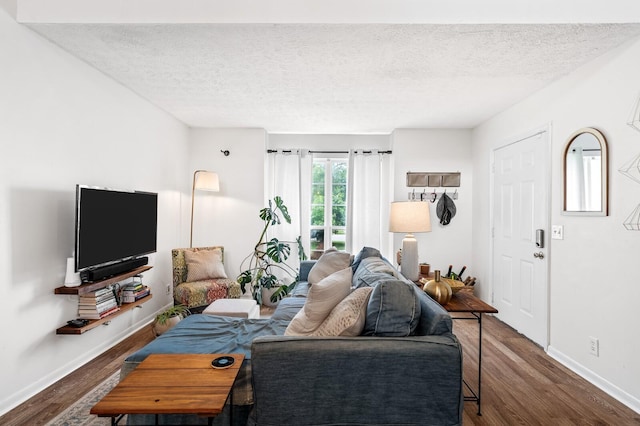 919 Rachels Pl, Hermitage, TN 37076 - living room with dark wood-type flooring, a textured ceiling, and baseboards