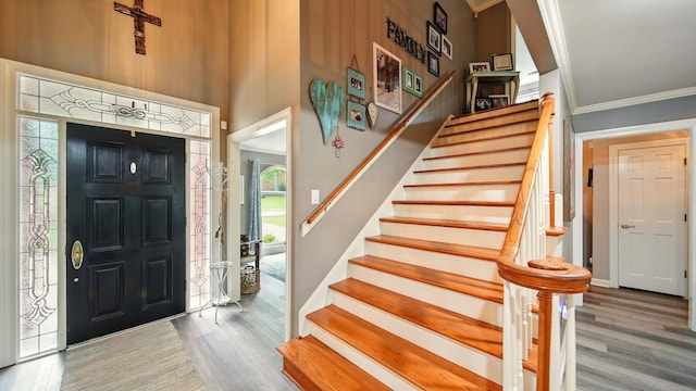2458 Carrollwood Ln, Cordova, TN 38016 - entryway featuring crown molding, wood finished floors, stairs, and a towering ceiling